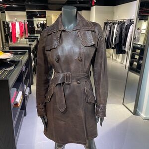 Distressed brown leather trench with pink contrast stitching